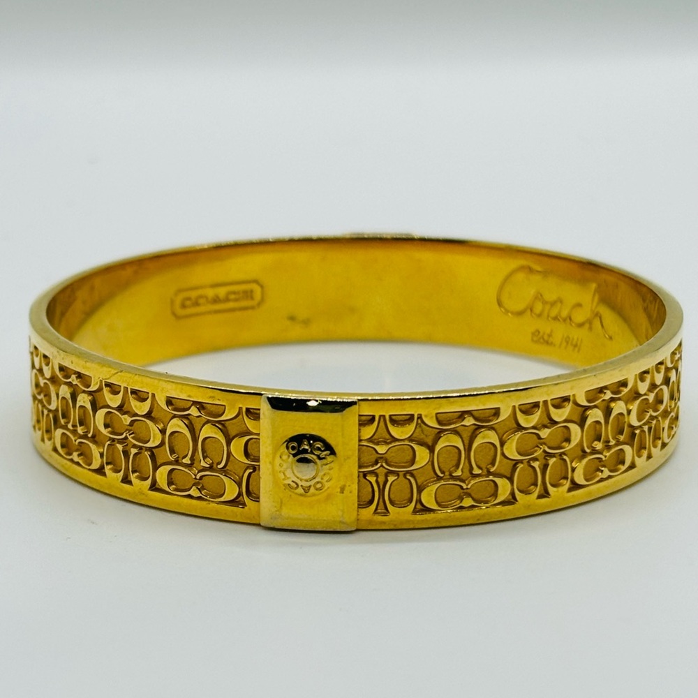 COACH Signature Classic “C” logo gold plated bangle bracelet 2.5” diameter.
